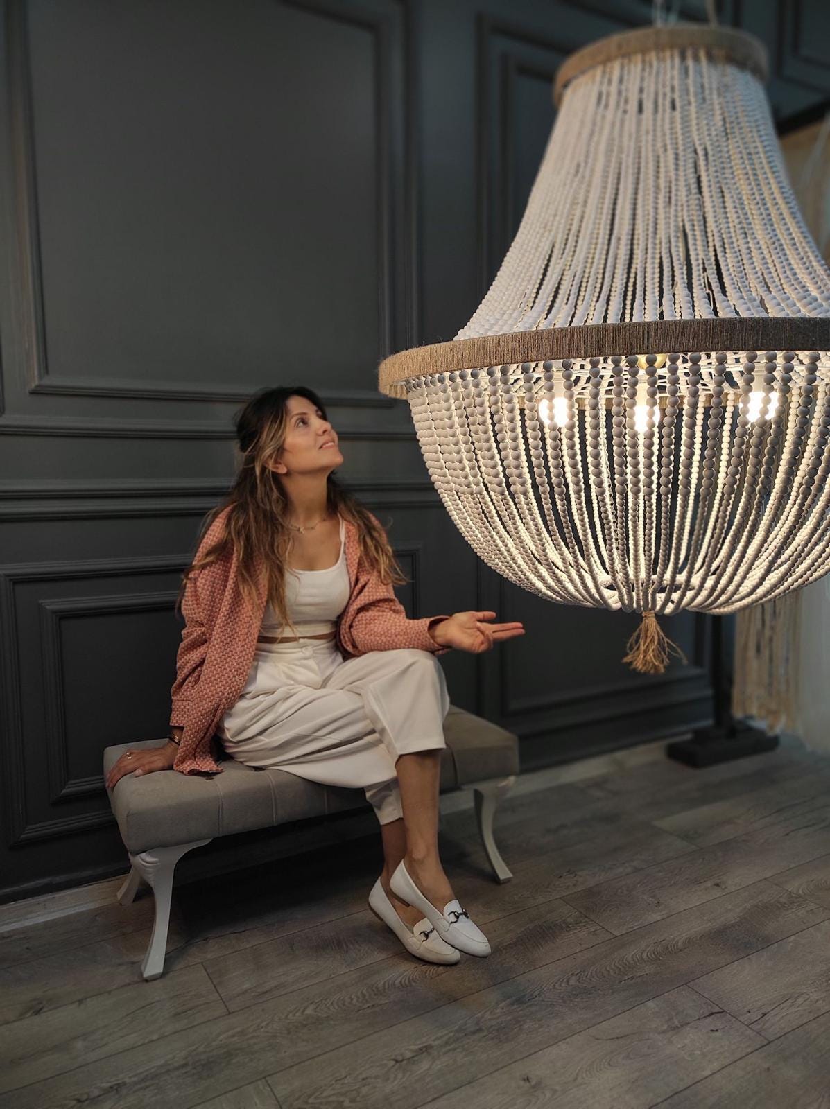 "Handcrafted wooden bead chandelier, 80 cm in diameter, ideal for boho and rustic decor. Creates a warm atmosphere with its elegant, curved design. Made from high-quality natural materials, it complements modern, farmhouse, or coastal-themed decor."